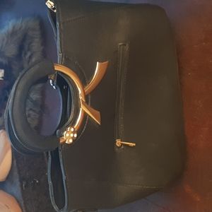 Faux leather Handbag front and inside plus two additional inside Pockets.